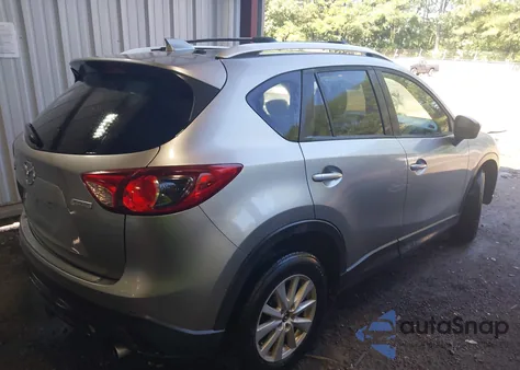 2014 Mazda Cx-5 Touring z USA, uszkodzony, nr VIN JM3KE2CY7E0317859